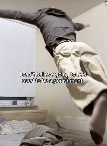 A person in mid air jumping into bed with the caption “i can't believe going to bed used to be a punishment.”
